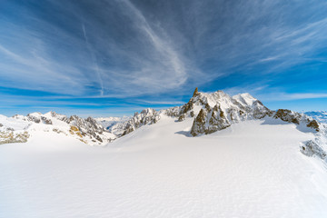 Wall Mural - panorama of the snow covered glacier on top of the mont blanc massif between italy and france, the h