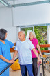 © jovannig - Group of elderly people rehabilitating indoor in a gym with asian trainer
