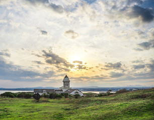 Beautiful catholic church on morning with sunrise and blue sky in Seopjikoji Mount Jeju Island , South Korea