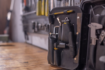 Wall Mural - Set of tools, screws, pliers and nuts on a workshop background