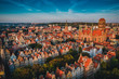 Gdansk is a city in Poland. Gdansk in the morning rays, the sun is reflected from the roofs of the old city.
