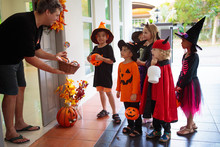 Kids Trick Or Treat. Halloween. Child At Door.