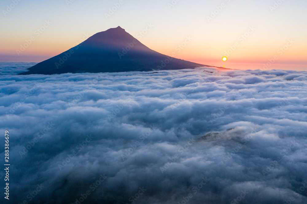 Aerial Image With Magical Sunset Over A Low Cloud Layer Covering Pico aerial-image-with-magical-sunset-over-a-low-cloud-layer-covering-pico