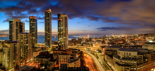 Wall Mural - Dramatic clouds during sunrise looking over San Francisco skyline