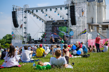 Couple is watching concert at open air music festival