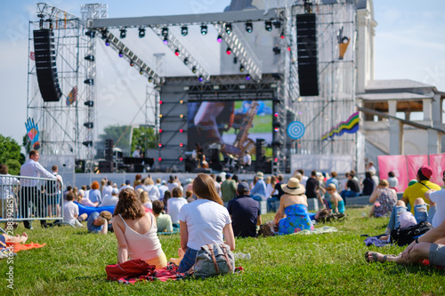 Fotomural Couple is watching concert at open air music festival