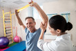 © Yakobchuk Olena - Man doing rehab exercises with female medic