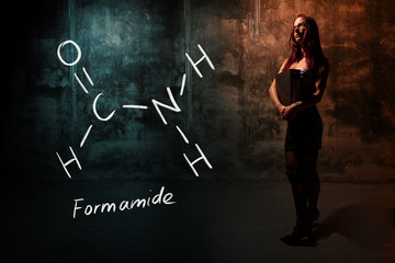 Wall Mural - Sexy girl or secretary or female student presenting handdrawn chemical formula of Formamide