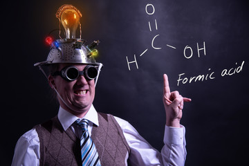 Nerd presenting handdrawn chemical formula of formic acid