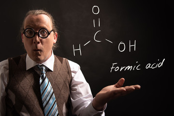 Professor presenting handdrawn chemical formula of formic acid