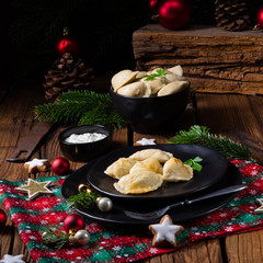 Wall Mural - Polish Christmas pierogi with sauerkraut and mushrooms