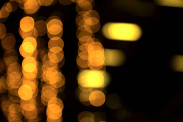 Wall Mural - blurry background image of defocused golden color abstract decoration lights pattern