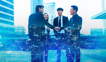 Double exposure worker hand shake teamwork brainstorming with innovation business. concept success investment.Business People Handshake Greeting Deal Concept.