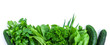 fresh green vegetables and herbs border on white background