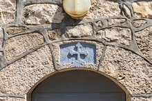 Cross Above The Door To The Residential Building In The Greek Orthodox Monastery Of The Transfiguration Located On Mount Tavor Near Nazareth In Israel