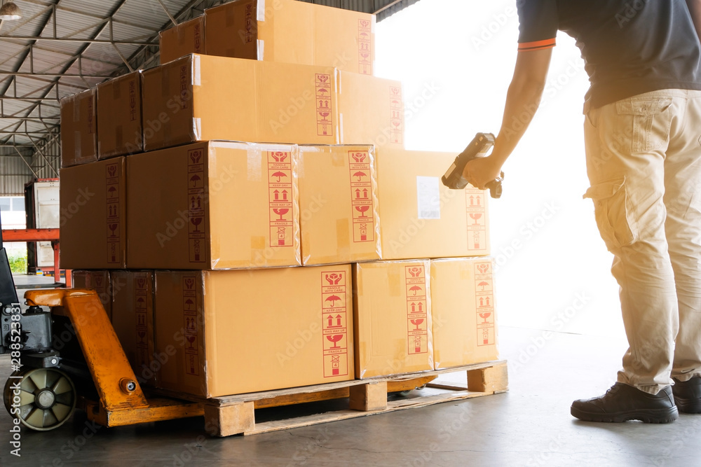 Workers Scanning Bar Code Scanner on Packaging Boxes. Shipping ...
