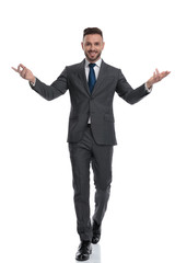 Wall Mural - happy young businessman is walking and welcoming with hands outstretched