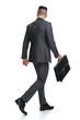 © Viorel Sima - back view of a  businessman walking and looking to side