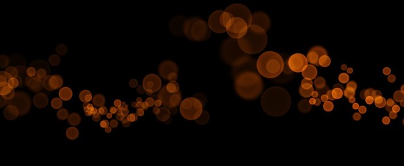 Orange bokeh isolated on black background 