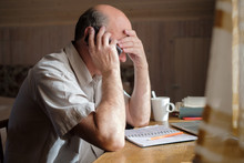 Senior Man Feeling Upset Having Phone Conversation Depressed By Hearing Bad News