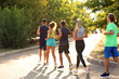 © Pixel-Shot - Group of sporty young people running outdoors
