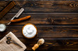 © 9dreamstudio - Men's hairdressing tools on dark wooden background top view copy space
