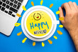 © zakokor - Happy weekend quote and coffee cup on blue background with laptop computer and hand resting over desk. Time to break concept.