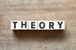 Letter block in word theory on wood background