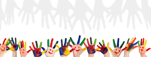 Children's smiling colorful hands raised up. The concept of classroom or back to school