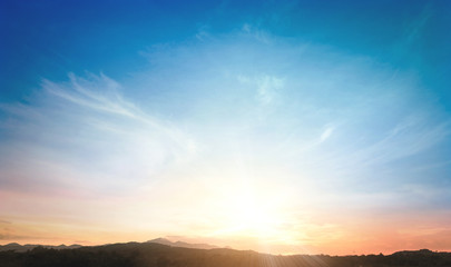 Wall Mural - world environment day concept: sun light and mountain sky of heaven autumn sunset background