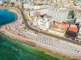 Wall Mural - Aerial birds eye view drone photo of Elli beach on Rhodes city island, Dodecanese, Greece. Panorama with nice sand, lagoon and clear blue water. Famous tourist destination in South Europe