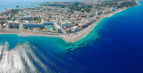 Wall Mural - Aerial birds eye view drone photo of Elli beach on Rhodes city island, Dodecanese, Greece. Panorama with nice sand, lagoon and clear blue water. Famous tourist destination in South Europe