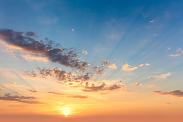Wall Mural - sunrise sundown sky with soft clouds and sunbeams