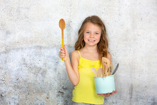 Beautiful Girl Is Posing With Cooking Spoon In The Studio