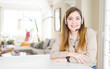 © Krakenimages.com - Beautiful young operator woman wearing headset at the office with a happy and cool smile on face. Lucky person.
