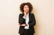 © Asier - Young business african american woman looking sideways with doubtful and skeptical expression.