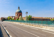 French ancient town Toulouse and Garonne river panoramic view. Toulouse is the capital of Haute Garonne department and Occitanie region, France, South Europe. Famous city and tourist destionation.