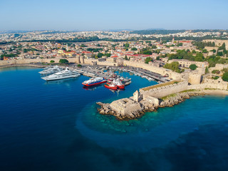 Wall Mural - Aerial birds eye view drone photo of Rhodes city island, Dodecanese, Greece. Panorama with Mandraki port, lagoon and clear blue water. Famous tourist destination in South Europe