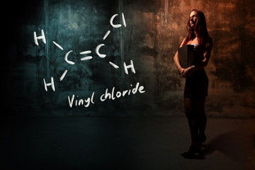 Sexy girl or secretary or female student presenting handdrawn chemical formula of vinyl chloride