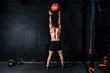 © Srdjan - Young strong sweaty focused fit muscular man with big muscles doing throwing medicine ball up on the wall for training hard core workout in the gym real people selective focus