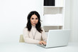 © burdun - Happy woman call center assistent sitting at the desk and wworking computer making different calls