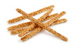 Sesame stick crackers or grissini isolated on white background