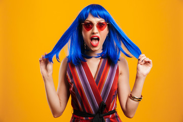 Sticker - Portrait of cute shocked woman wearing blue wig and sunglasses looking at camera and shouting