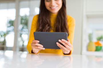 Wall Mural - Beautiful young woman working using touchpad tablet