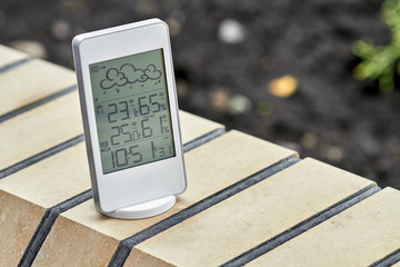 Wall Mural - Best personal weather station device with weather conditions inside and outside. Home digital weather forecast concept with temperature and humidity.