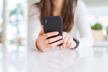 Close up of young woman using smartphone