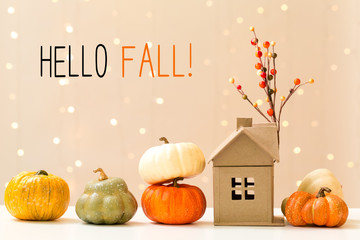 Wall Mural - hello fall message with collection of autumn pumpkins with a toy house