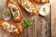 baked sweet potato with cream, herbs and spices