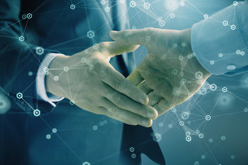 Double exposure of tech drawing on abstract background with two men handshake. Concept of technology in modern business