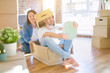 © Krakenimages.com - Funny and crazy couple having fun riding a cardboad box as a car, smiling happy and laughing at new home